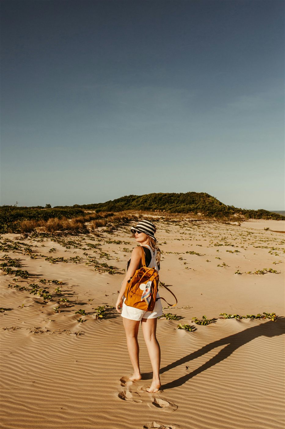 Solo traveler exploring dunes